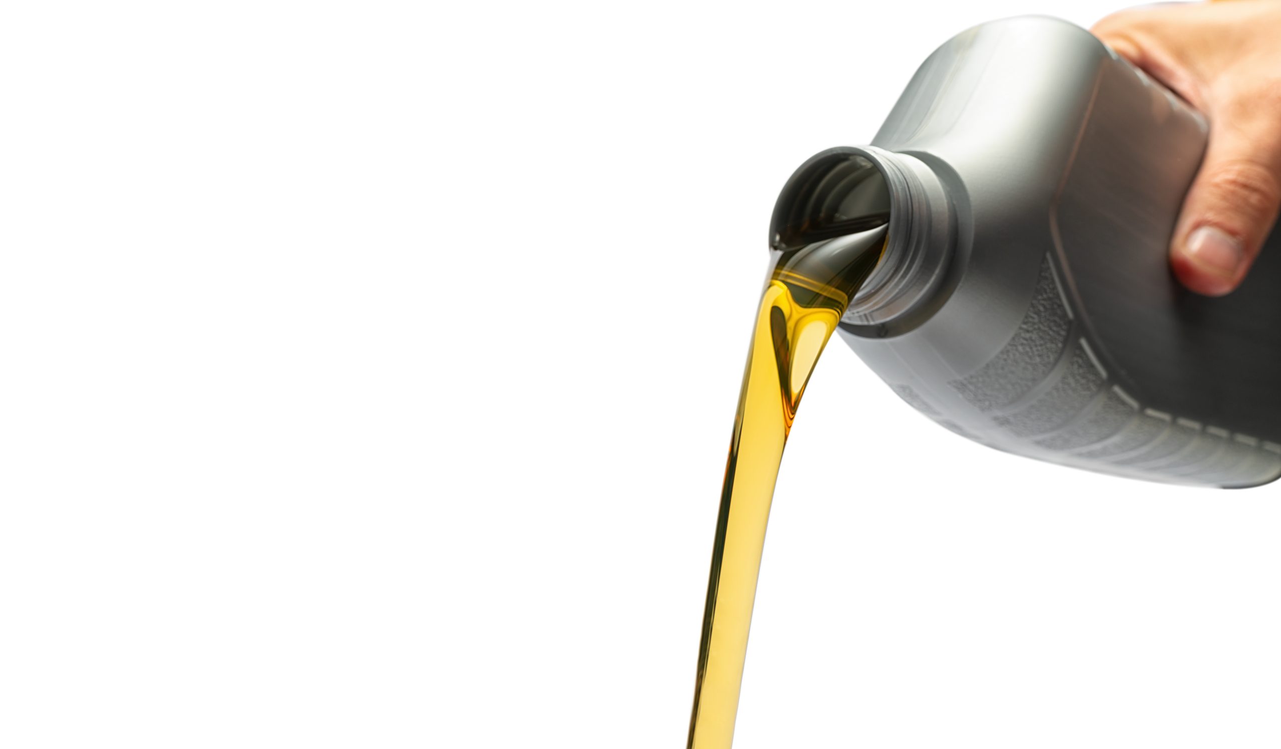 hand Pouring oil lubricant motor car from a bottle on isolated w ideal for websites and magazines layouts